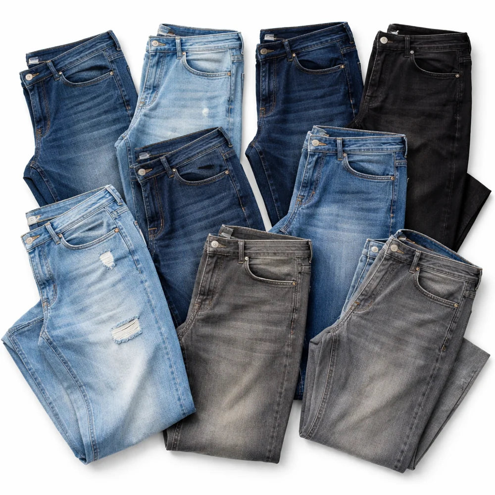 Collection of folded jeans in various shades of blue and black on a white background