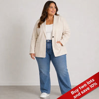 A woman modeling a light beige blazer over a white top and blue jeans, standing against a plain light gray studio background with a red promotional banner in the lower right corner.