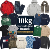 A collage of multiple apparel items arranged around a central text panel reading '10kg Sports & Designer Brands Rewearable Grade.' Visible products include a red Adidas jacket, blue jeans, a gray Nike hoodie, a green The North Face puffer, a navy Calvin Klein sweatshirt, a green polo, a beige button-front shirt, a black Under Armour shirt, a colorful Guess graphic T-shirt, a Tommy Hilfiger flag shirt, a Champion sweatshirt, and several other branded tops and sweaters.