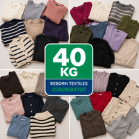 A collage showing many folded knit and cable-knit sweaters and cardigans in assorted colors, arranged around a central green and blue sign that reads '40 KG REBORN TEXTILES 07801684700'.
